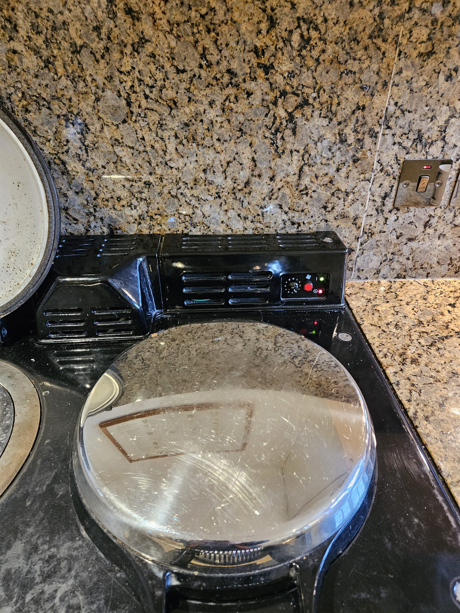 Gas hob burning safely in a domestic kitchen
