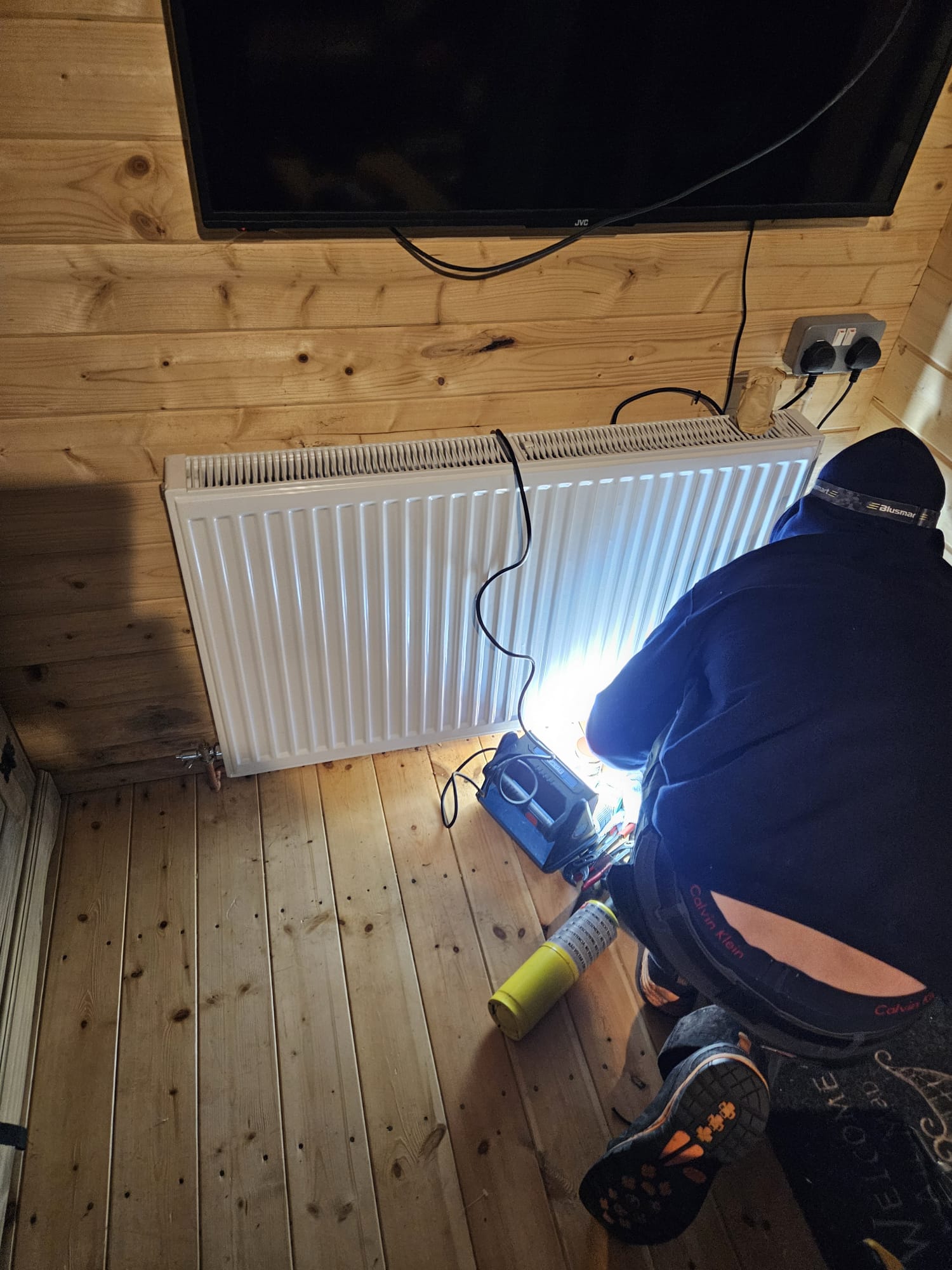 Underfloor heating manifold with pressure gauges and connected pipes