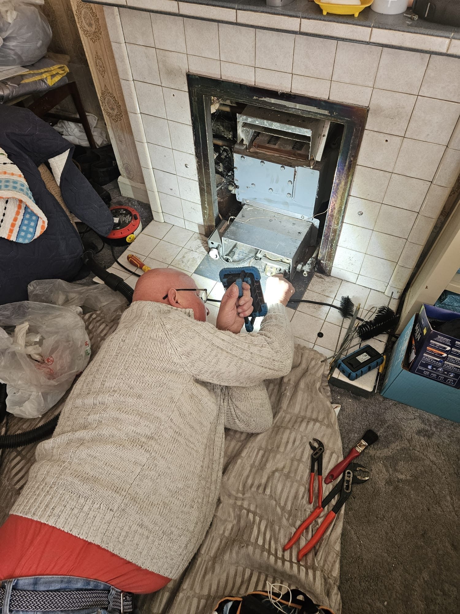 Engineer checking a gas regulator and pressure gauges